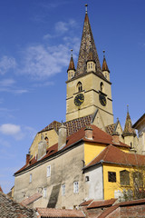 Fototapeta na wymiar medieval tower with blue sky in background