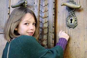 young tourist knocking on museum door