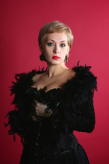 Fototapeta premium The blonde in a black boa
