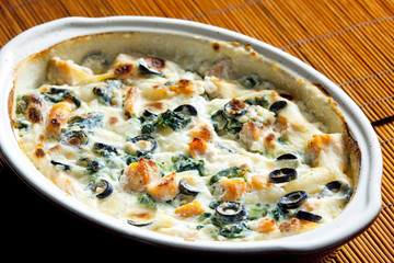 baked gnocchi with salmon, spinach and black olivves