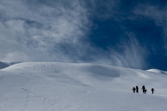 ski hiking group in alps