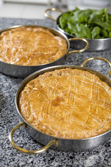 fresh home made spinach and artichoke  pie on a plate