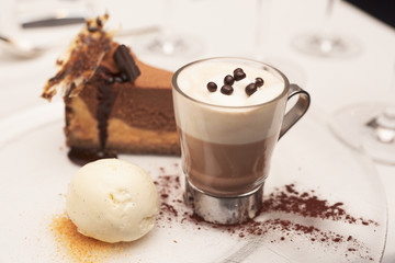 Cheesecake with vanilla ice-cream and hot cacao