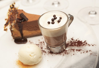 Cheesecake with vanilla ice-cream and hot cacao