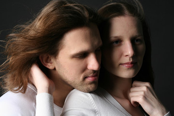 Young Man and woman isolated on black background