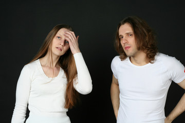 Young Man and woman isolated on black background