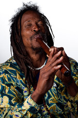 Rastafarian playing the flute