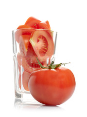 Tomato slices in glass isolated on white background.