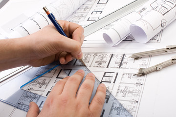 Architectural plans and blueprints in office