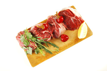 raw meat chunk on wood