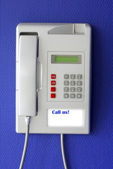Wall phone on blue background
