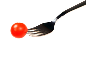 Cherry tomato on  steel fork