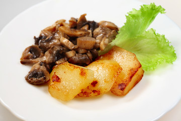 Fried potatoes  and roasted mushrooms