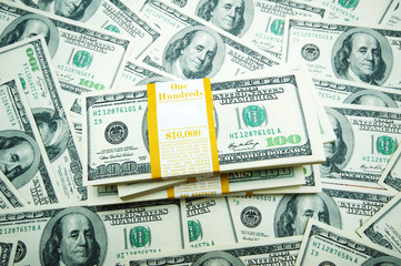 Fototapeta premium Stack of dollars on money background
