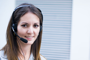 Happy profesional woman with headset