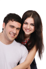 a beautiful young couple posing in studio