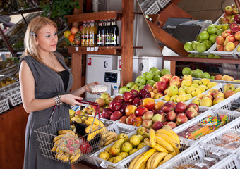 Woman grocery shopping in supermarket