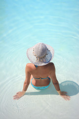 Beautiful young woman at a pool