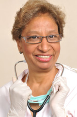 Mixed raced nurse with stethoscope smiling