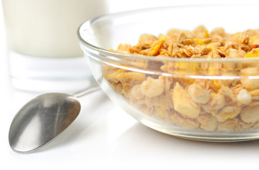 muesli with milk isolated on white