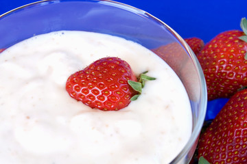 Closeup Of Cup With Yoghurt And Strawberries