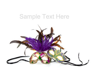 Mardi gras masks on white with copy space