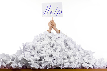 Person in pile of papers