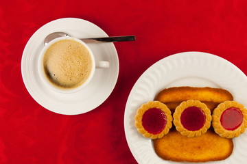 Coffee and cookies on a red background