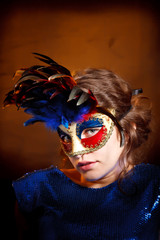 Young woman in carnival mask