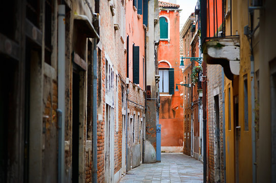 Fototapeta Narrow street in Venice