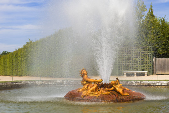 The Ceres fountain spraying water in Versailles Chateau. France