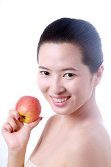 Close-up portrait of sexy asian young woman holding one apple
