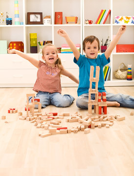 Kids proud of their wooden block buildings