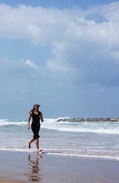 woman during fitness on sea beach