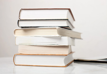 Stack of books on the white table