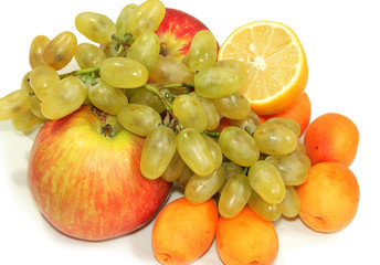 Still life with grapes, apricots and lemon