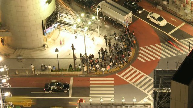 Time Lapse Movie Tokyo cross-walk from high above at night.