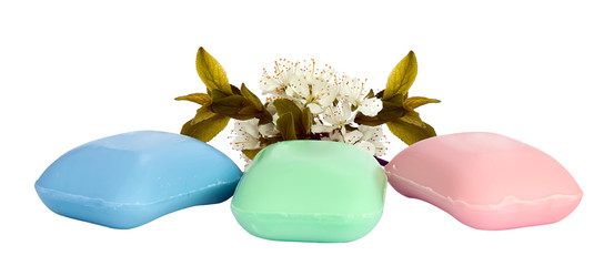 The pieces of soap with a sprig of cherry blossoms.