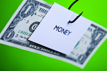 Dollar sign on piece of paper on hook