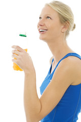 woman wearing  sports vest with bottle of energy drinks