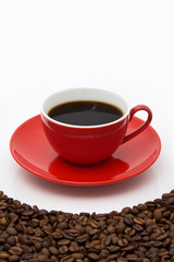 Red coffee cup and beans.