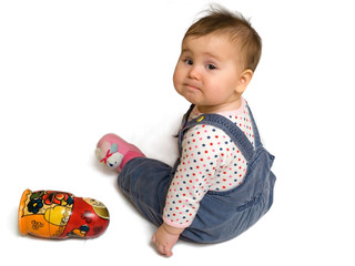 Sad baby boy and matreshka toy
