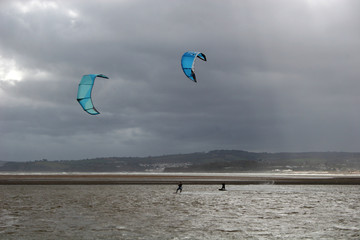 kitesurfers  in stormy weather