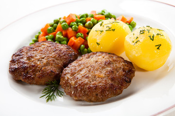 Fried pork chop  with boiled potatoes and vegetables