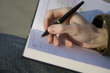 writing in notebook close-up