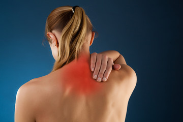 Woman massaging pain back