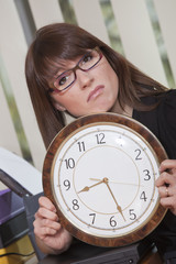 unhappy woman holding big watch