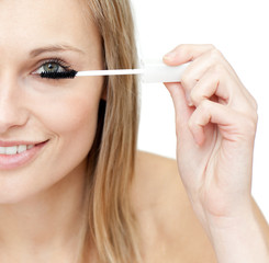 Close-up of a woman putting mascara