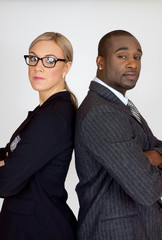 Mixed race couple with arms crossed
