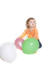 Fototapeta na wymiar cute toddler girl with balloons over white